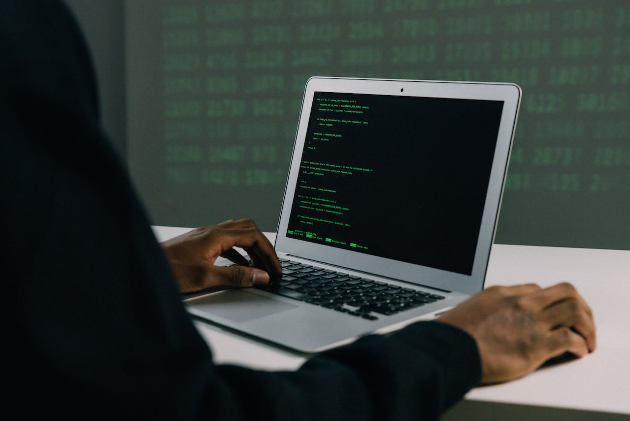 black man hands using computer writing code