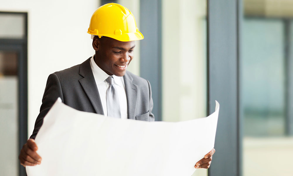 black student in suit with yellow hardhat