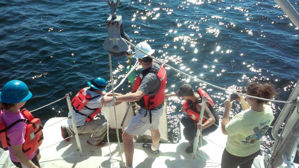 marine sciences on boat overhead students water