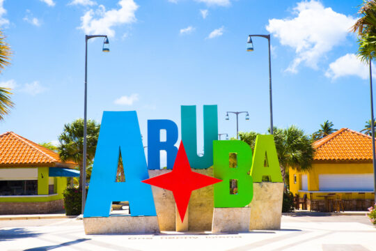 aruba tourism colorful welcome sign